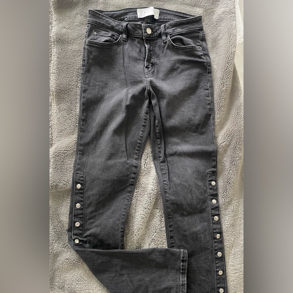 Black Iro Denim jeans with button detailing near the bottom of the pant!
